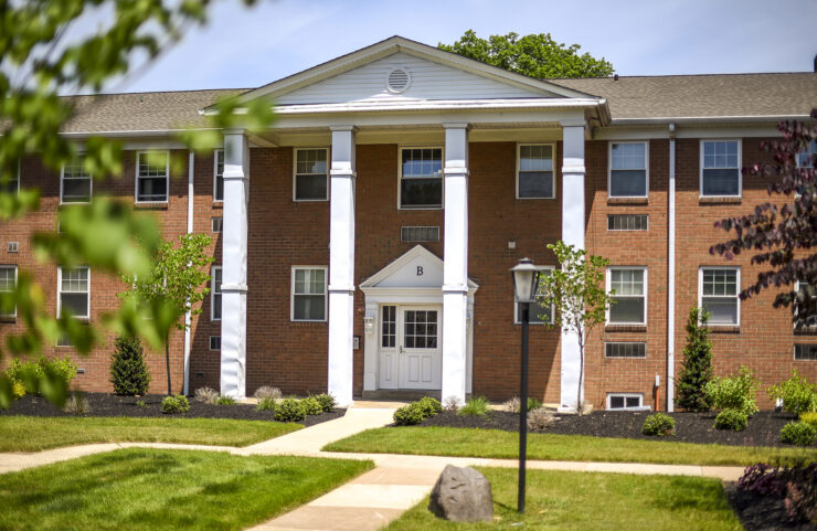 exterior with walking paths and landscaping