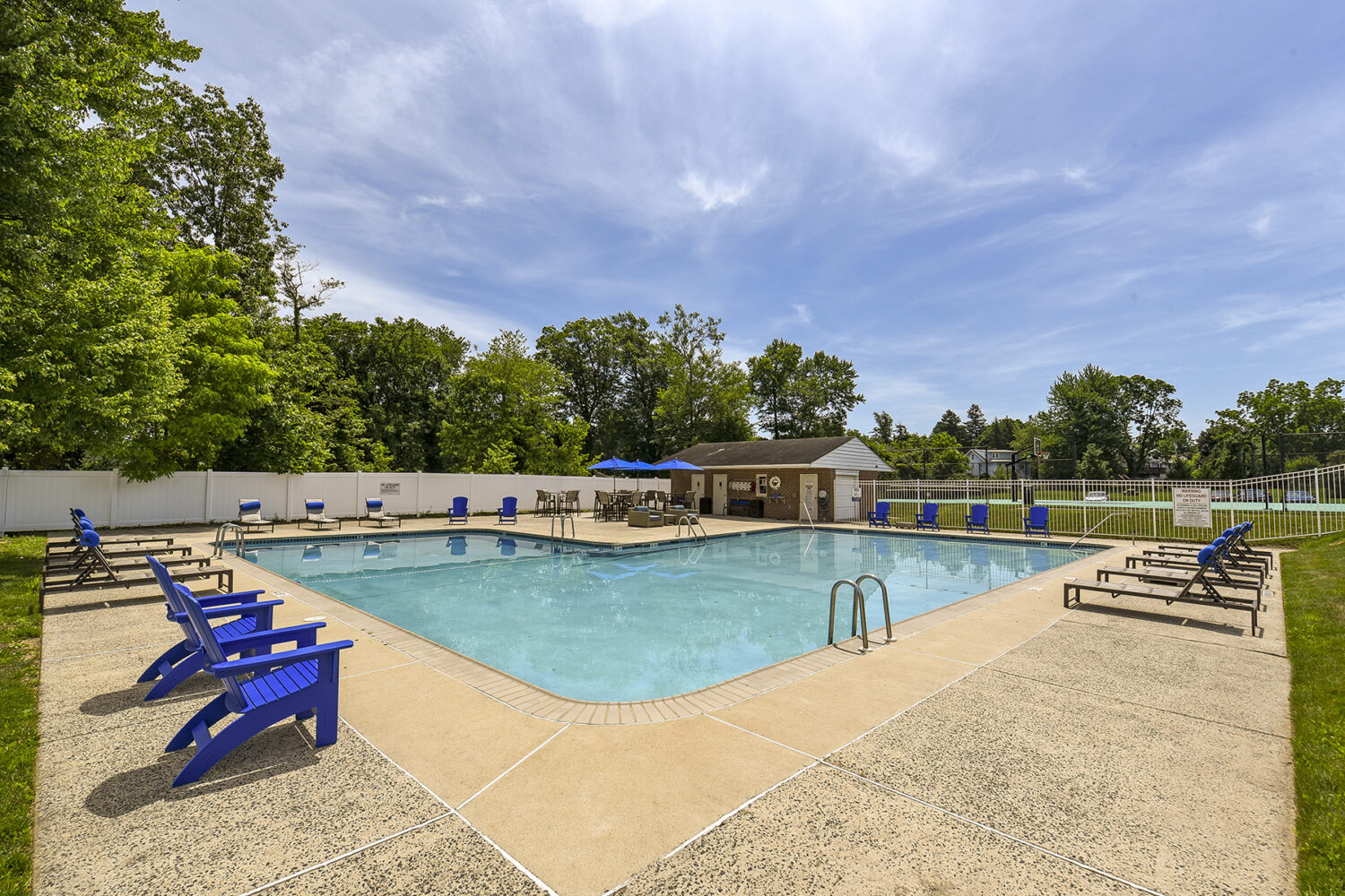 pool with blue chairs