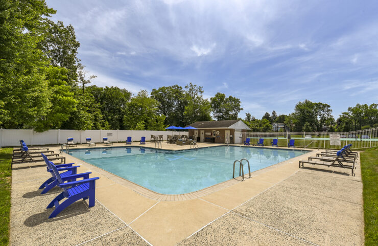 pool with blue chairs