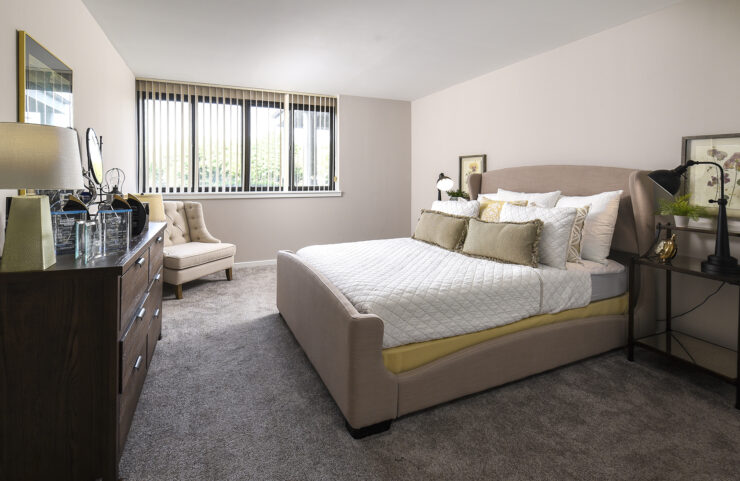 spacious bedroom with wall to wall carpet