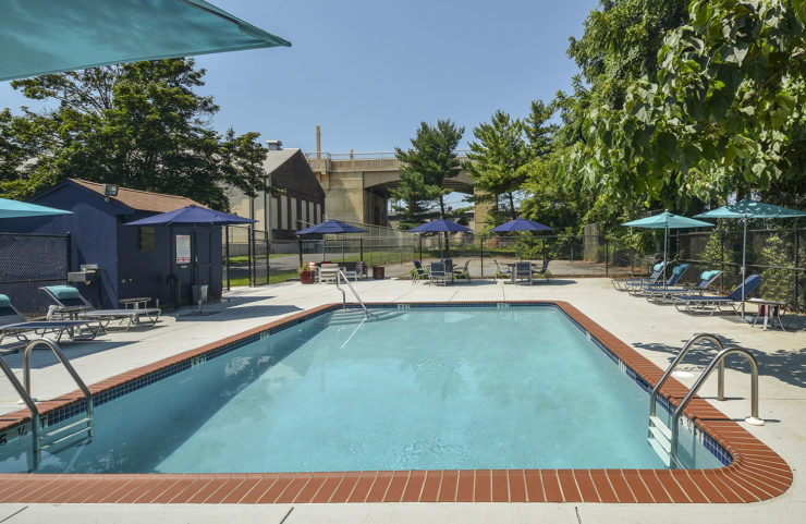 outdoor pool with lounge chairs 