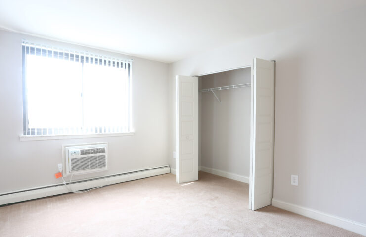 large bedroom with wall to wall carpet 