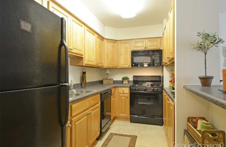 standard kitchen with oak colored cabinets 