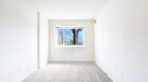 bedroom with wall to wall carpet and large window