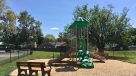playground with a bench to sit 