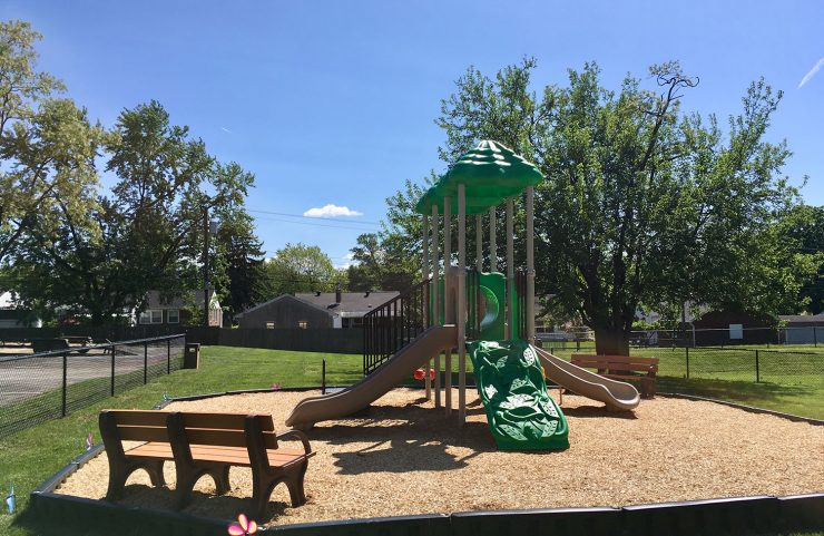 playground with a bench to sit 