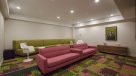 screening room with three large sofas and two chairs with tables 