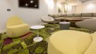 modern yellow and white chairs in the resident lounge 