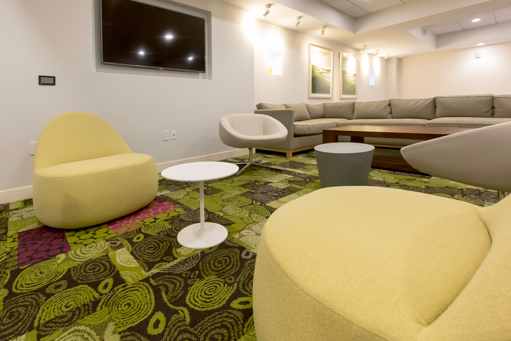 modern yellow and white chairs in the resident lounge
