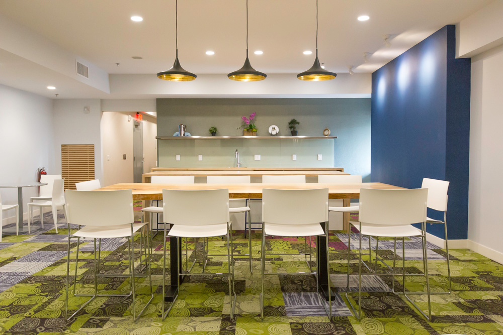 resident lounge with shared kitchen and table to seat 10