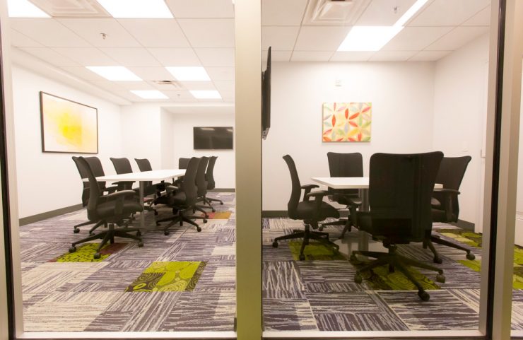 conference rooms with rolling chairs and tvs 