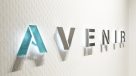 backlit Avenir sign on wall in lobby
