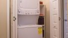 stackable washer and dryer in a roomy closet 