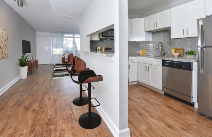 dining and kitchen with white cabinets 