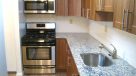 modern kitchen with wood cabinets and granite countertops