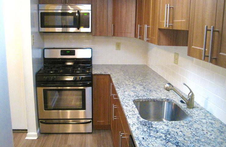 modern kitchen with wood cabinets and granite countertops