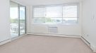 living area with sliding door to balcony