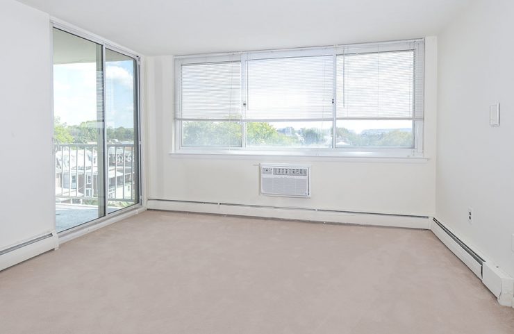 living area with sliding door to balcony