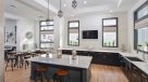 kitchen with island and bar seating in the community center 