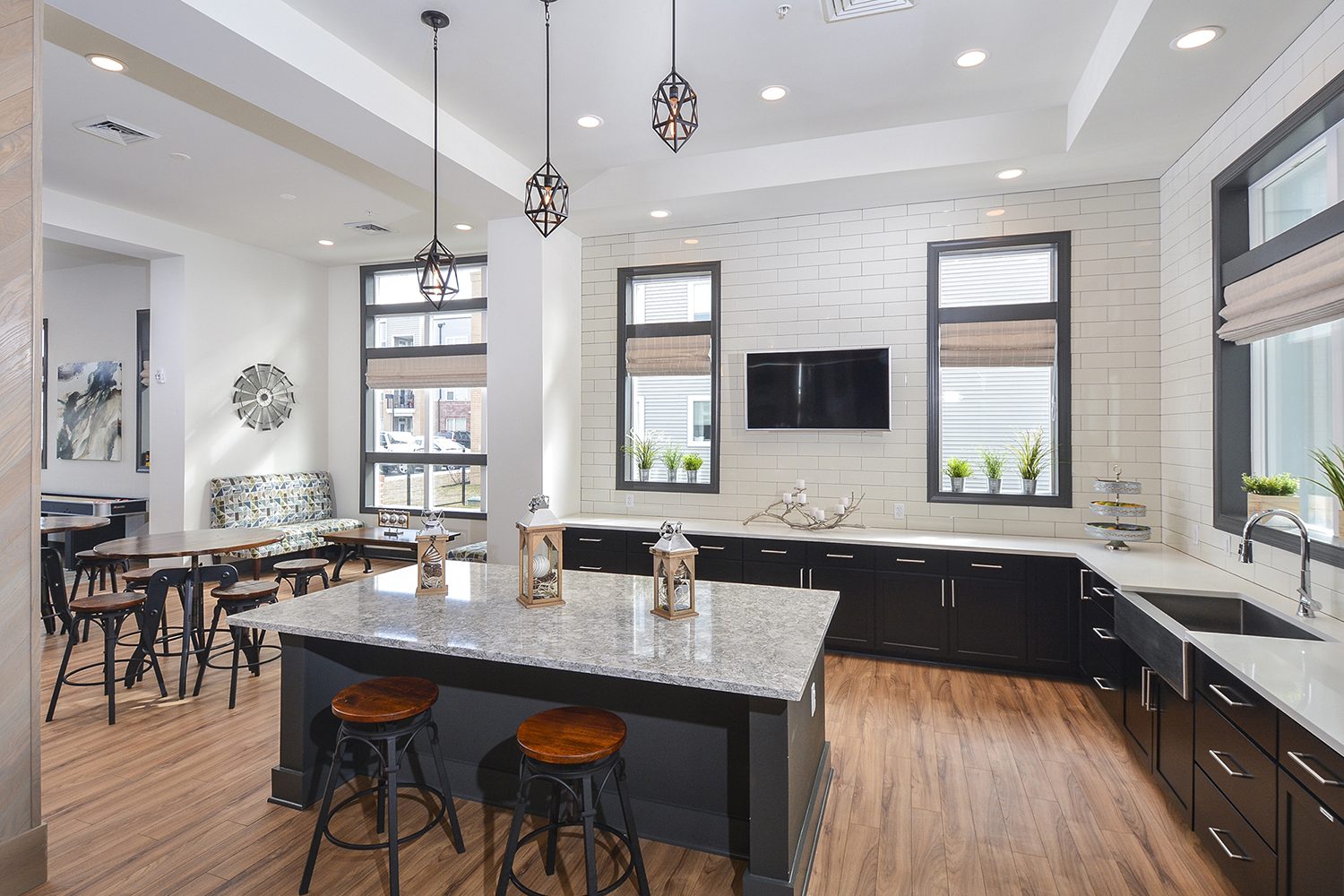 kitchen with island and bar seating in the community center 