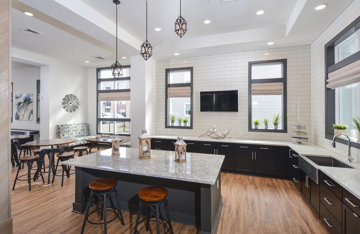kitchen with island and bar seating in the community center 