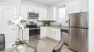 eat in kitchen with light vinyl plank flooring 
