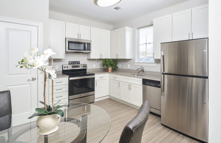 eat in kitchen with light vinyl plank flooring 