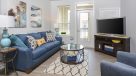 living room with light vinyl plank flooring 