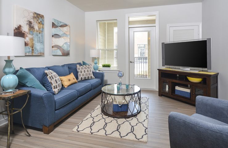living room with light vinyl plank flooring 