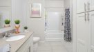 bathroom with tile floor and large vanity 