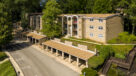 aerial view of exterior apartments and carports 