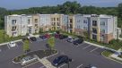 aerial view of apartments and parking lot 
