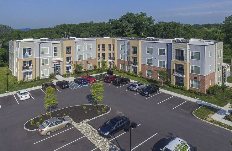 aerial view of apartments and parking lot 