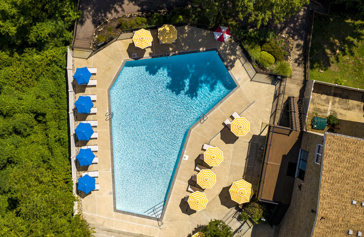 Pool With Patio Furniture and Umbrella Tables