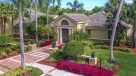 leasing office entrance with beautiful landscaping along walkway 