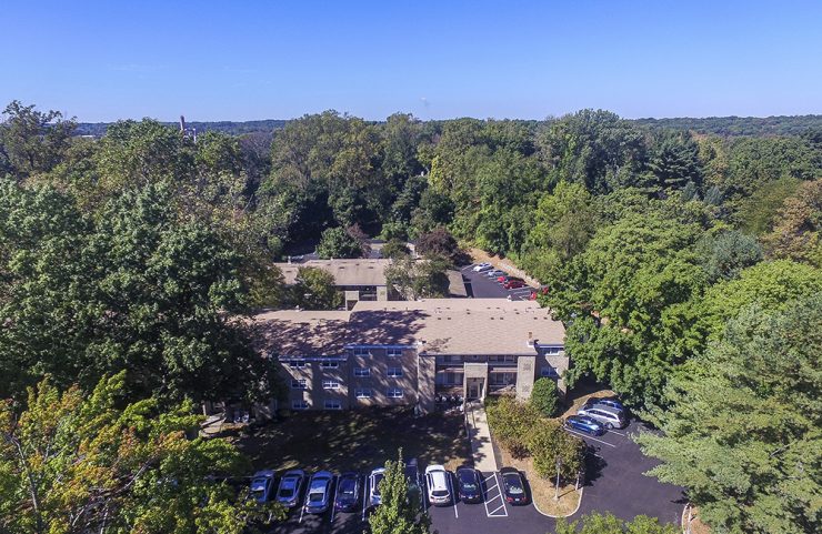 aerial view of exterior apartments and parking lot 