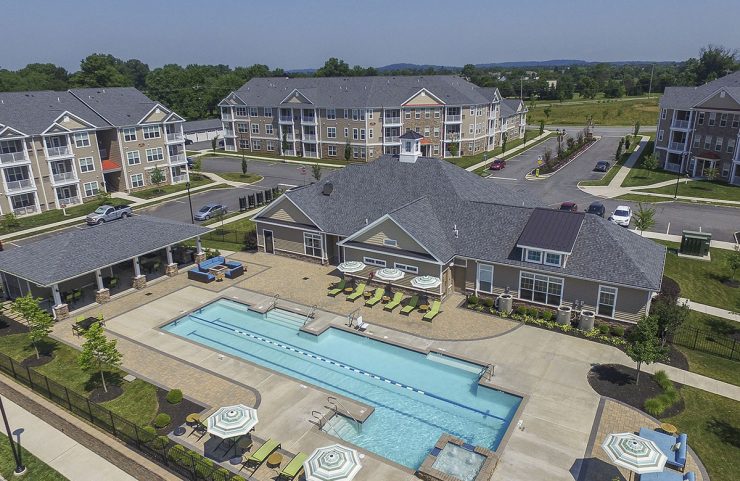 aerial view of the outdoor pool and clubhouse 