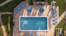 Outdoor pool with lounge chairs in Boca Raton 