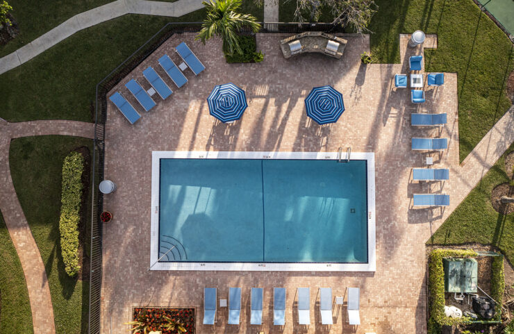 Outdoor pool with lounge chairs in Boca Raton 