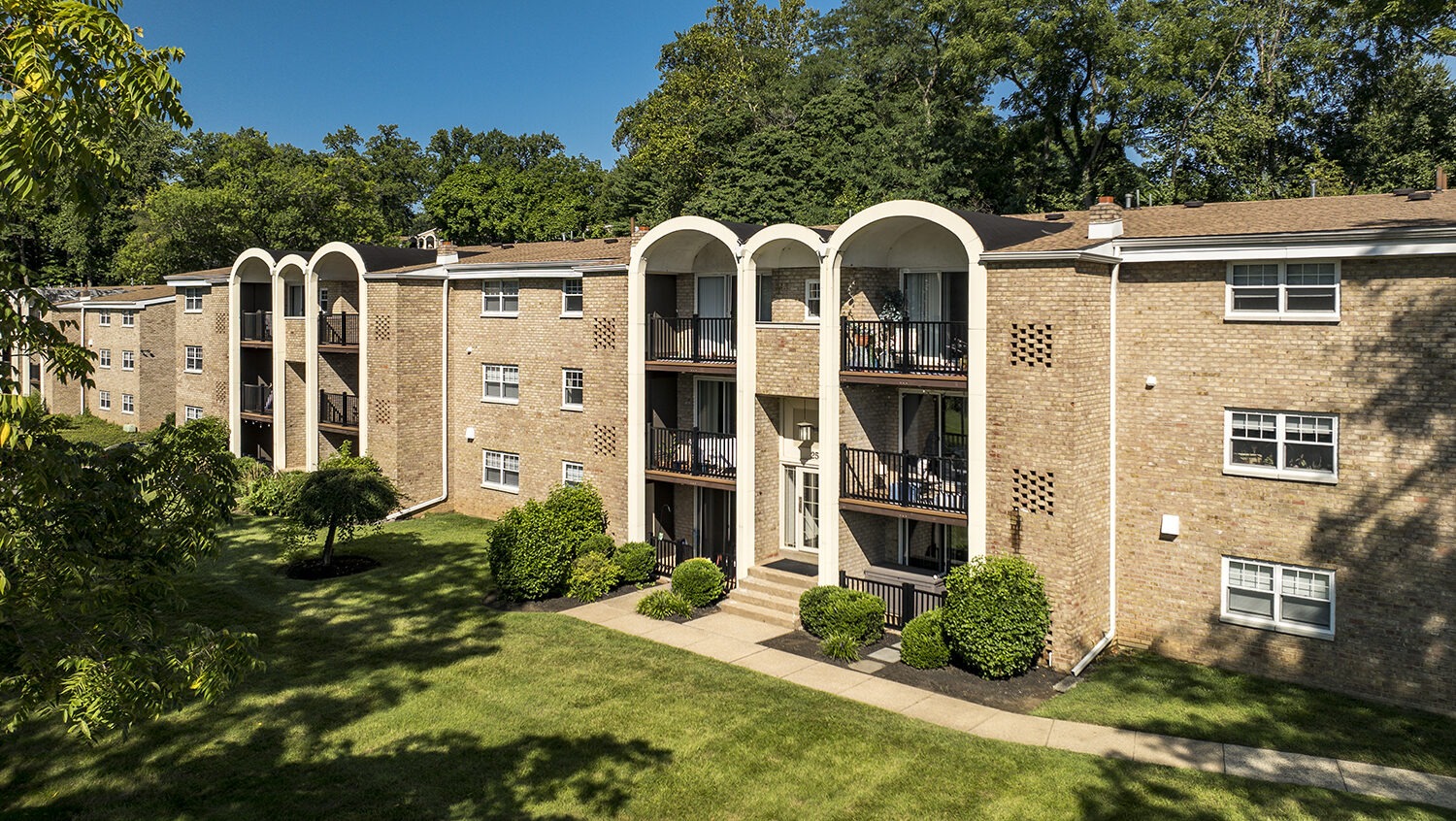 aerial view of exterior apartments and carports 