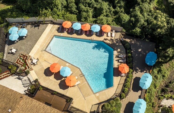 Pool With Patio Furniture and Umbrella Tables