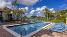 heated swimming pool with lounge chairs 