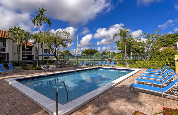 heated swimming pool with lounge chairs 