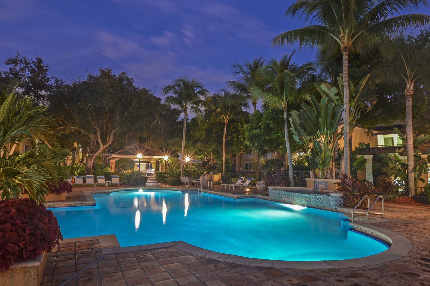 outdoor pool lit up at night