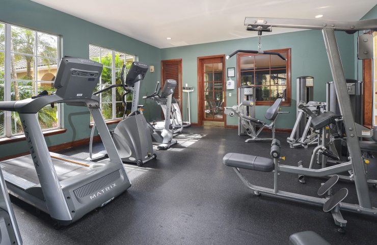 cardio equipment and weight machines in the fitness center 