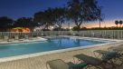 view of the sunset by the pool 
