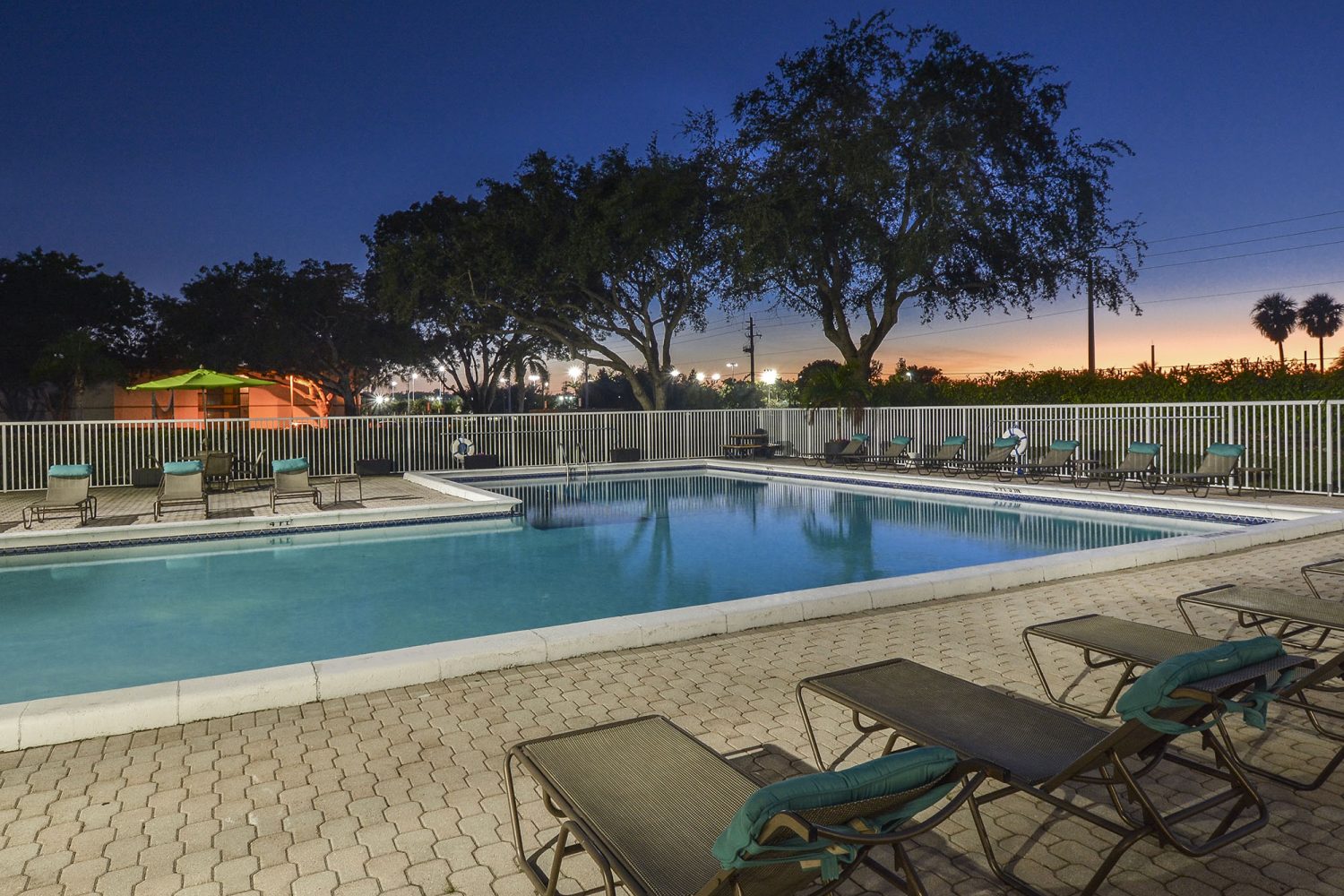 view of the sunset by the pool 