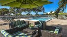 lime and blue padded seating area next to pool 