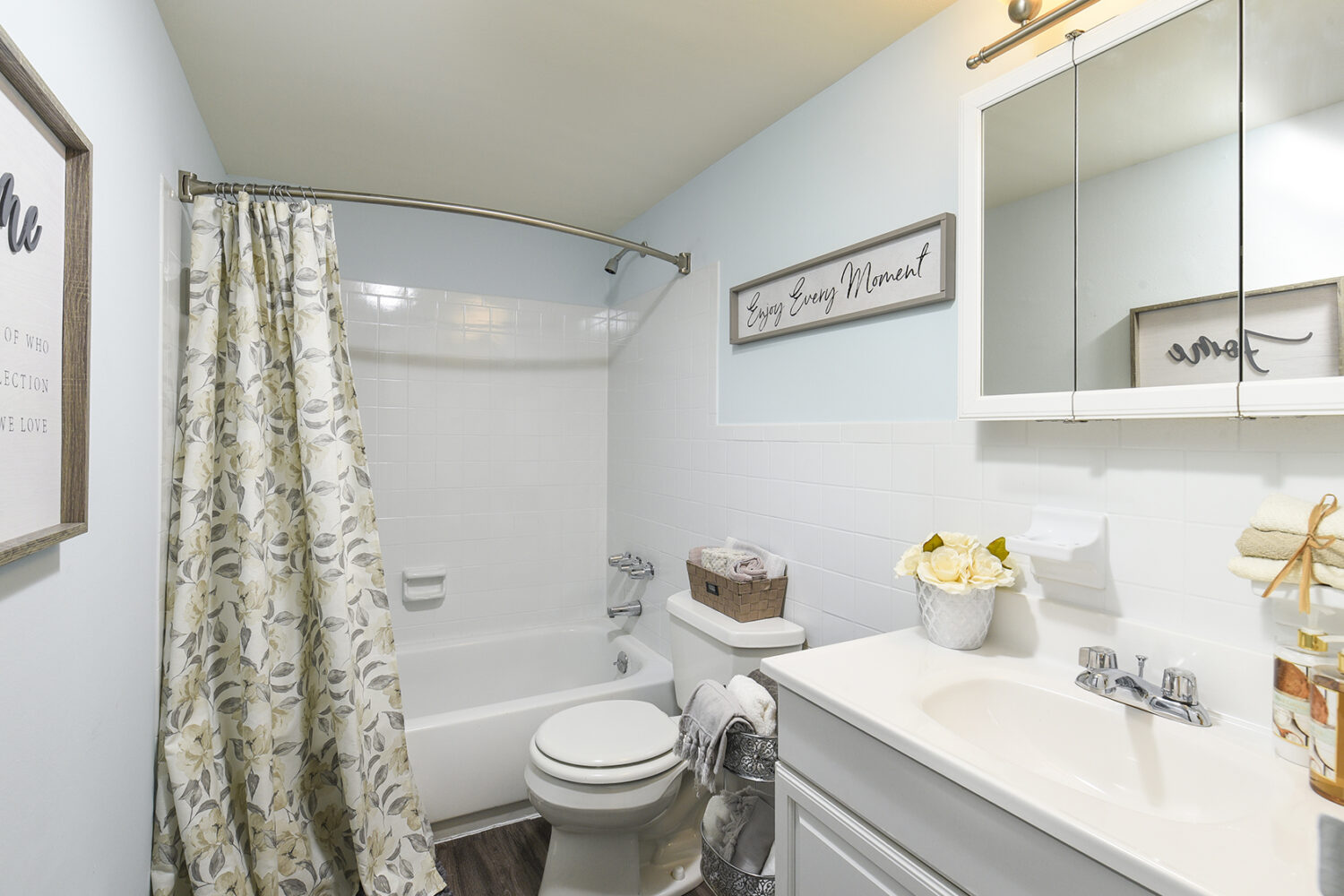 bathroom with white vanity and tub