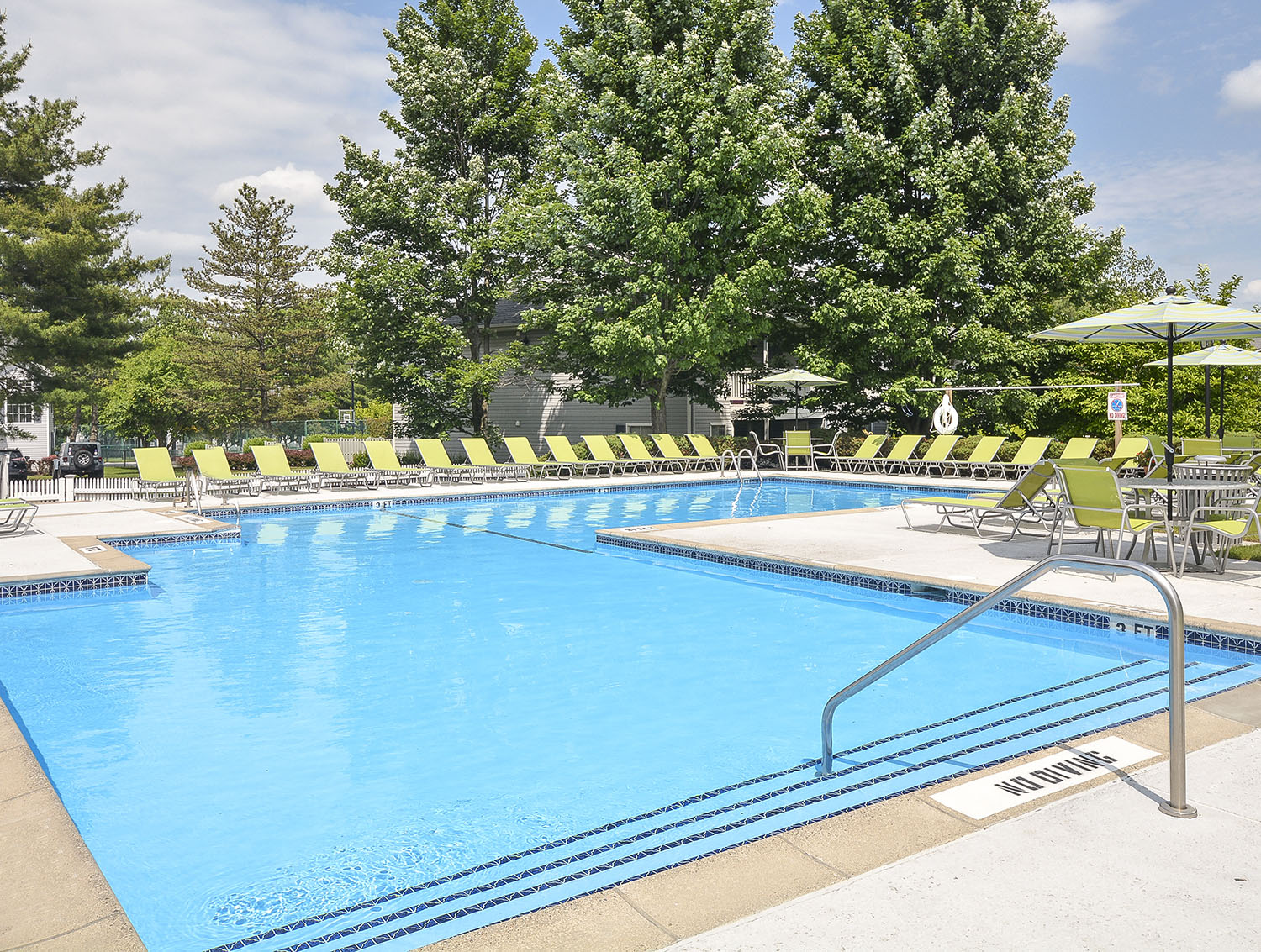 heated outdoor pool with lounge chairs 